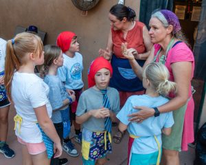Volunteers instructing kids
